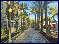 Explanada de España 05 - this is the fashionable palm promenade the goes along the coastline in the city centre of Alicante, with curve shaped tile patterns. Filled with restaurants and market stalls.