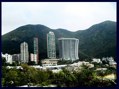 Repulse Bay in Southern district, Hong Kong. The curved 26-storey postmodern highrise building is called "The Lily" and was designed by Norman Foster. It is situated between Stanley, Deepwater Bay and Aberdeen, and is one of the most expensive housing area in HK.