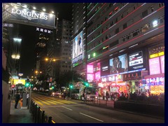 Nathan Road, the main road of Tsim Sha Tsui (TST), Kowloon really comes alive at night with all tasteless but still cool neon lights, cheap restaurants, expensive stores and luxury hotels. It is dubbed "The Golden Mile" and one of the longest and most important roads in Hong Kong. It is by far the most lively entertainment and shopping district, and one of the world's most crowded places.