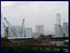 New riverfront development in front of Kowloon skyline.