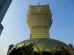 Grand Lisboa Hotel Casino was built in 2008, as a modern complement to the old Lisboa Hotel opposite the road. It is known for its significant lotus flower shaped, golden glass, 42-storey hotel tower that is Macau's tallest skyscraper (261m). It is also known for the golden glass oval shaped podium it stands on, that hosts the casino.