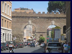 Via della Conciliazione side street with part of the ancient wall.