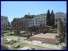 Largo di Torre Argentina is an ancient square with ruins of four republican, pre-empire temples, as well as the ruins of the theater, Teatro di Pompey. The square is situated in the historic Campus Martius (Field of Mars) area in central Rome.  
The oldest temple, the temple of Feronia, was constructed around 300BC. Today Largo di Argentina is famous for it's large number of stray cats, sometimes it is called the "Cat's forum", and it is surrounded by heavy traffic of cars and trams, here Corso Vittorio Emanuele II.