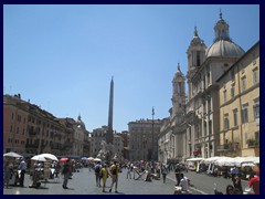 Piazza Navona with The white church is Sant'Agnese in Agone and the obelisk belongs to the Fountain of the Four Rivers.