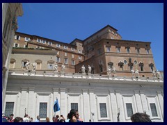 The Papal Palace, Palace of the Vatican or Apostolic Palace, seen fro St Peter's Square. This is where the popes reside, inside the Papal Apartments. The building also houses the Vatican Museums, the Vatican library and the Sistine Chapel.