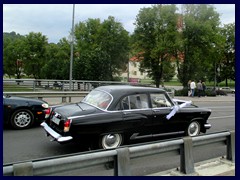 Vintage Russian wedding cars at Mindaugo bridge.