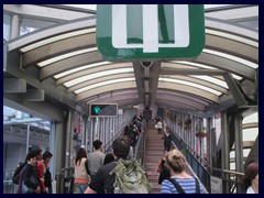 Central_Escalator, first, lower, part near Central Market.  Because of rush hour, the escalators run downhill between 6 and 10 in the morning, and uphill the rest of the day. It has been in operation since 1993.