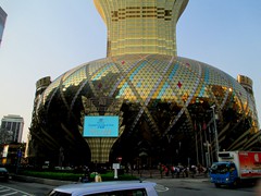 Grand Lisboa Hotel Casino was built in 2008, as a modern complement to the old Lisboa Hotel opposite the road. It is known for its significant lotus flower shaped, golden glass, 42-storey hotel tower that is Macau's tallest skyscraper (261m). It is also known for the golden glass oval shaped podium it stands on, that hosts the casino.