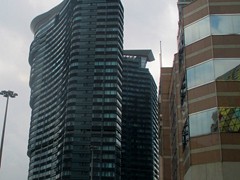 Lake View Tower is a 30-storey residential skyscraper opposite Grand Lisboa. It was built in 2009 and has curved shapes. To the right is Bank of China.