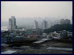 Macau sunset skyline with Zhuhai, China in the background. Zhuhai is situated across the Chinese border and has about 1.5 million inhabitants, twice as much as Macau. Zhuhai has an impressive skyline.