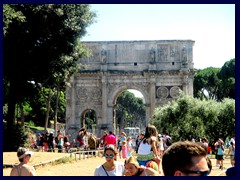 Arch of Constantine, a  triumphal arch, situated between the Colosseum and the Palatine Hill. It was built in 315 AD to commemorate Emperor Constantine's victories. It spans the Via Triumphalis, a walk that emperor's took when they entered the city in triumph.