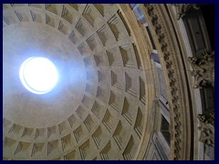 Pantheon is famous for it's dome with a hole on the top, called the Oculus, where sunlight ("the light of God") is shining down on the floor on sunny days.