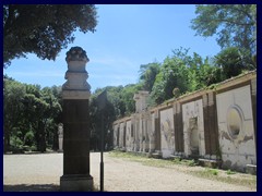 Villa Borghese, a bust and a wall that has fallen into disrepair. This wall used to be part of a Roman theater.