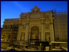 Fontana di Trevi is a baroque fountain at Piazza di Trevi  in the Trevi district in Rome's historical part. It is the most famous fountains in Rome, and is famous from the scene from the Fellini movie "La Dolce Vita" when Anita Ekberg bathed in it.
Unfortunately it was closed for renovations during our visit in 2015, and covered with glass panels and scaffoldings. It was designed by Nicolas Salvi. Before 1629, this was the terminal point of an important aqueduct. It is said that if you through a crown using the right hand over the left shoulder, you will one day return to Rome. 
Today you find pedestrian streets, icecream café, souvenir stores and restaurants in the Trevi area.