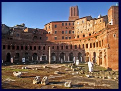 Forum Traiani (Trajan Forum) is Emperor Trajan's ancient forums where you find the ruins of one of the worlds first shopping centers (Trajan's Markets), that was built in 110AD to purchase goods and conduct business. Trajan's Markets had 150 small stores, "tabernaes" along the main road, Via Biberatica, and offices. It was designed by Trajan's favourite architect,Apollodorus of Damascus.