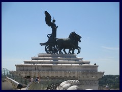 The other  Quadriga dell'Unità on the summit of Monument to Vittorio Emanuele II represents freedom, here seen from the rooftop observation deck.