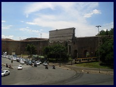 Part of the Aurelian city wall near with a tram passing through near Termini Station.