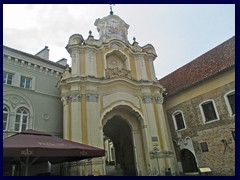 Holy Trinity Church & Basilian Gate, Didzioji street. A famous symbol can be found on top of this baroque gate that is part of the church.